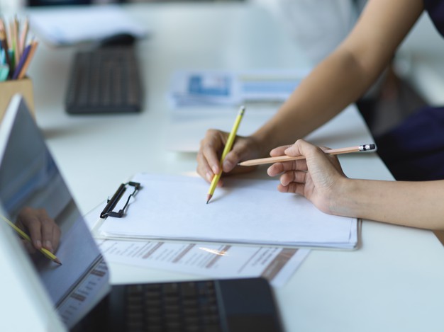 businesspeople-hands-working-together-paperwork-clipboard-table_67155-13399